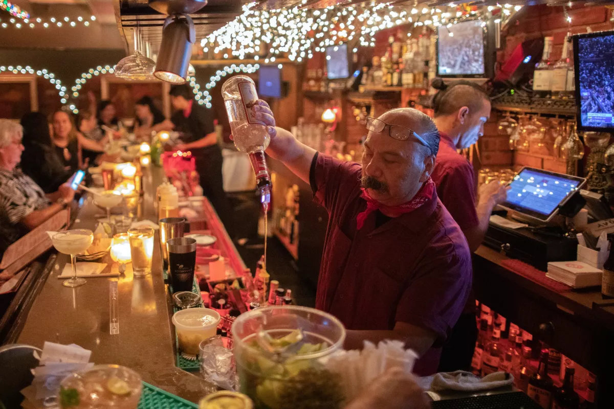 Bartender pouring shots